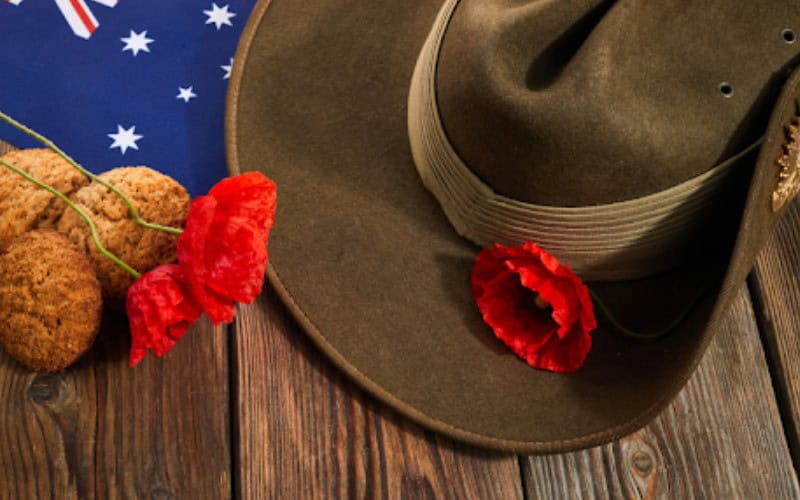 a hat and flowers on a table