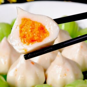 chopsticks holding a piece of food