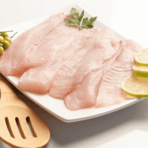 a plate of raw meat with lemons and limes