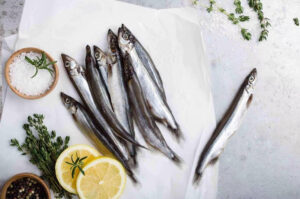 a group of fish on a white paper