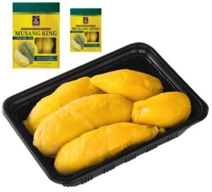 a black tray with yellow fruit in it