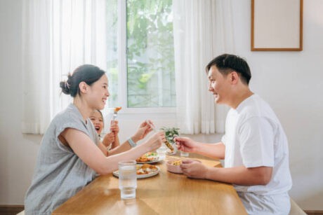 a man and woman eating at a table