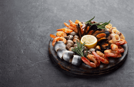 a plate of seafood on a gray surface