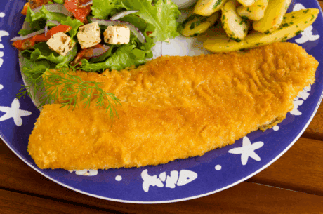 a plate of food with a side of salad