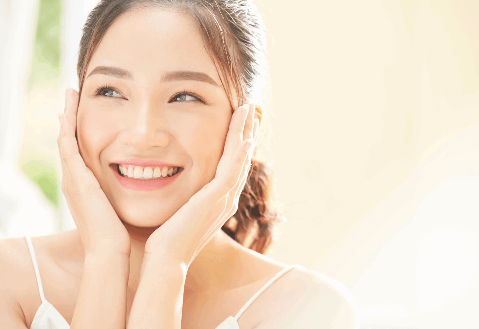 a woman with her hands on her face