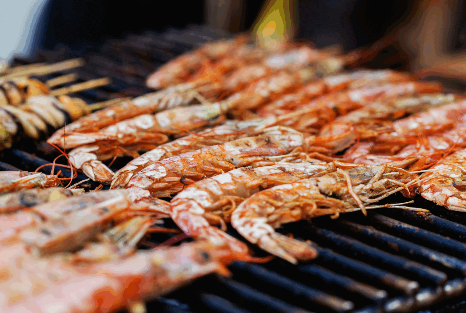 a group of shrimp on a grill